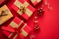 Gift boxes with bows on a red background with space for your text Royalty Free Stock Photo