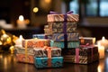 Gift boxes with burning candles on table in room, closeup, A beautiful scene of a stack of beautifully wrapped, delicious boxes Royalty Free Stock Photo