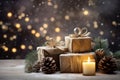 Gift boxes, candles and pine branches on bokeh lights background. Christmas and New Year background Royalty Free Stock Photo