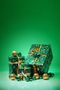 Gift boxes and christmas balls,Isolated on green background Royalty Free Stock Photo