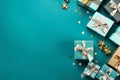 Gift boxes and Christmas decorations on a turquoise background. view from above. Festive frame for a greeting card. Selective Royalty Free Stock Photo