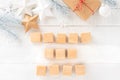 Gift boxes and Christmas ornaments with square wood blocks