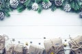 Gift boxes collection wrapped in kraft paper with border pine on white wood Royalty Free Stock Photo