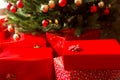 Gift boxes and decorated christmas tree, closeup Royalty Free Stock Photo