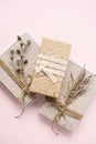 Gift boxes decorated dried flowers top view. Holidays present greeting concept Royalty Free Stock Photo