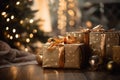 gift boxes with gold ribbon and christmas ornaments on the floor in front of the christmas tree Royalty Free Stock Photo