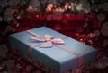 Gift boxes lie on a red shiny fabric. Package of gifts for Christmas.bokeh, small tree, bright festive background. Vignette Royalty Free Stock Photo