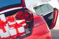 Gift boxes in a luggage carrier of the red car Royalty Free Stock Photo