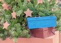 Gift boxes near a Christmas tree with shiny stars Royalty Free Stock Photo