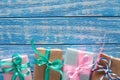 Gift boxes in paper on a blue wooden table Royalty Free Stock Photo