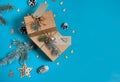 Gift boxes, pine branches, cones, wooden decorative toys on a light blue background. Christmas, winter, New year. Royalty Free Stock Photo