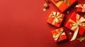 Gift boxes on red background in a flat lay, top view, with copy space Royalty Free Stock Photo