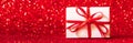 Gift boxes on red glittering background. Christmas concept, banner format Royalty Free Stock Photo