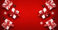 Gift boxes scarlet. White gifts with scarlet ribbon, New Year balls and sparkling lights in Christmas composition on dark red Royalty Free Stock Photo