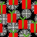 Gift boxes seamless pattern, red boxes with green ribbons and snowflakes on a black background Royalty Free Stock Photo