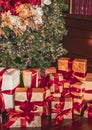 Gift boxes and traditional Christmas tree, wrapped presents and decor in colonial style as holiday home decoration