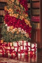 Gift boxes and traditional Christmas tree, wrapped presents and decor in colonial style as holiday home decoration