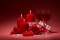 Gift boxes, two glasses with wine, burning candles, red roses and hearts on red background. Valentine`s day. Wedding day Royalty Free Stock Photo