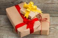 Gift boxes wrapped with kraft paper on wooden background, top vi Royalty Free Stock Photo