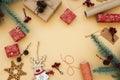 Gift boxes wrapped in red and craft paper and the contents of a workspace composed. Flat lay. Christmasr gift packing. Christmas