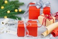 Gift boxes, wrapping paper, ribbons and Christmas decoration on light grey background Royalty Free Stock Photo