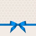 Gift Card With Blue Ribbon And A Bow on beige background. Gift Voucher Template with place for text.