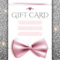 Gift card with bow on silver glitter background Royalty Free Stock Photo