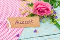 Gift card with the german word, Auszeit, means timeout with rose flower Royalty Free Stock Photo