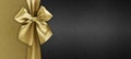 Gift card with golden ribbon bow isolated on black background template with copy space for Merry Christmas or black friday Royalty Free Stock Photo