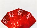 Gift cards. Four red gift cards Arranged in a fan shape. Royalty Free Stock Photo