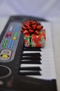 Gift close-up on synth keys with a soft blurred background