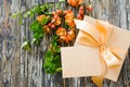 Gift box with bow ribbon, blank tag and delicate flowering branch Royalty Free Stock Photo