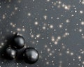 Black Christmas baubles with snow glitter shine, luxury brand winter holiday card
