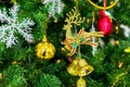 Gift deer and bell on tree christmas decoration for happy holiday Royalty Free Stock Photo