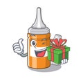 With gift ear drops in the mascot pillbox