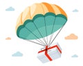 a gift falls on a parachute from the sky.