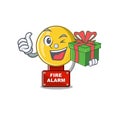 With gift fire alarm with the character shape Royalty Free Stock Photo