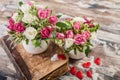 Gift Floristics. Handmade bouquet of roses with herbs in a large mug. Close up. Great gift for Mothers Day, March 8 or Valentines