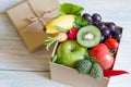 Gift of fresh fruits and vegetables on wooden board healthy diet lifestyle concept Royalty Free Stock Photo