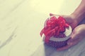gift giving,man hand holding a heart shape gift box in a gesture Royalty Free Stock Photo