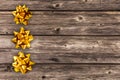 Gift golden bow with stars composition on old wood background. Winter, sale and seasonal concept. Merry Christmas, New