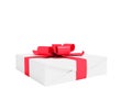 Gift wrapped in white paper with red bow and ribbons small for gift for the new year on the day of birth for praise 3d render on w Royalty Free Stock Photo