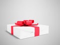 Gift wrapped in white paper with red bow and ribbons small for g Royalty Free Stock Photo