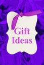 Gift ideas message gift tag over colorful purple glossy paper