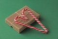 Gift Kraft Brown Color Box and Candy Canes Red and White in Hear Royalty Free Stock Photo