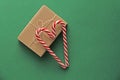 Gift Kraft Brown Color Box and Candy Canes Red and White in Hear Royalty Free Stock Photo