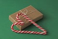 Gift Kraft Brown Color Box and Candy Canes Red and White in Hear Royalty Free Stock Photo