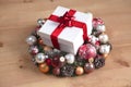 A gift lying on the Christmas wreaths on the