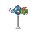 With gift miniature mascot on shape straight ahead Royalty Free Stock Photo