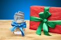 Gift and money on a wooden table Royalty Free Stock Photo